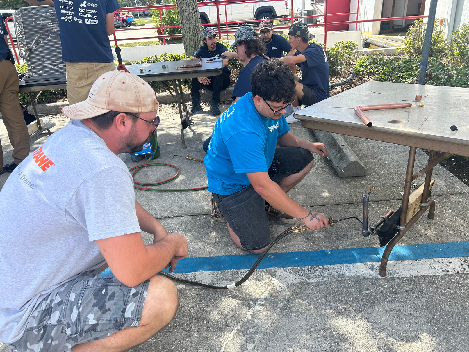 Student brazing copper pipe